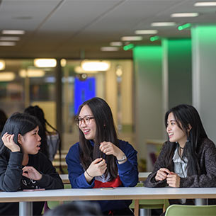 Group of three UWE Bristol students chatting