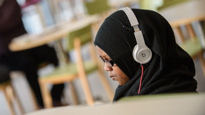 A student watching a webinar