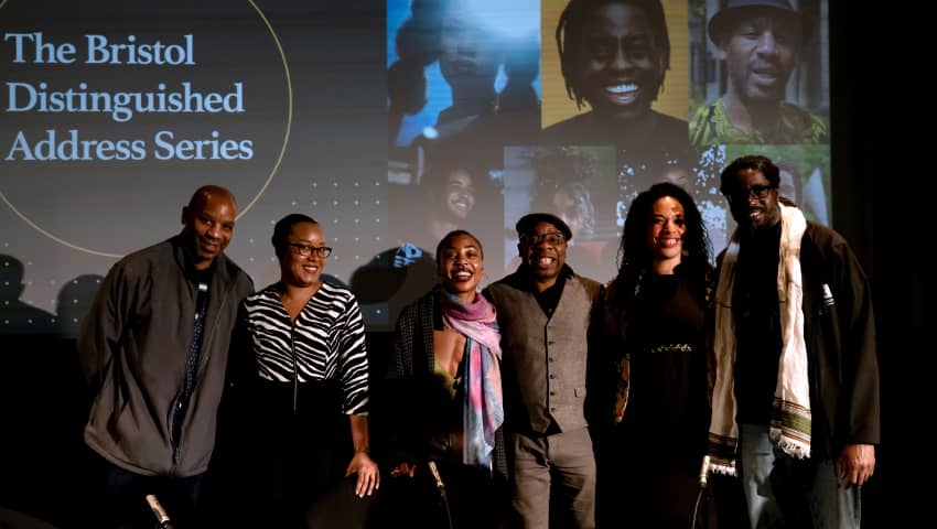 Panel of speakers at BDAS event standing and smiling together.