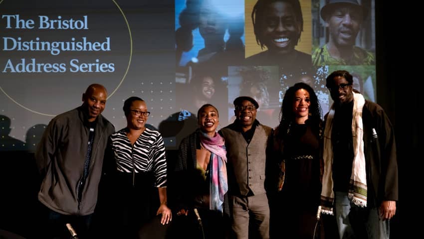 Panel of speakers at BDAS event standing and smiling together.
