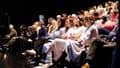 An audience in an auditorium.