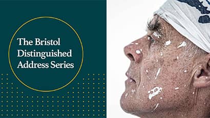 BDAS event poster featuring Sir Richard Long with white paint sploshes on his face.