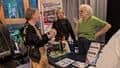 A stall holder talking to a guest after the BDAS Waste to Worth event.