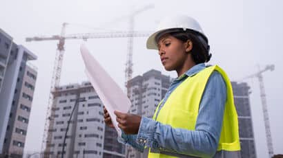 A civil engineer consulting plans for a build on site.