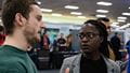 Two people talk at the employers fair