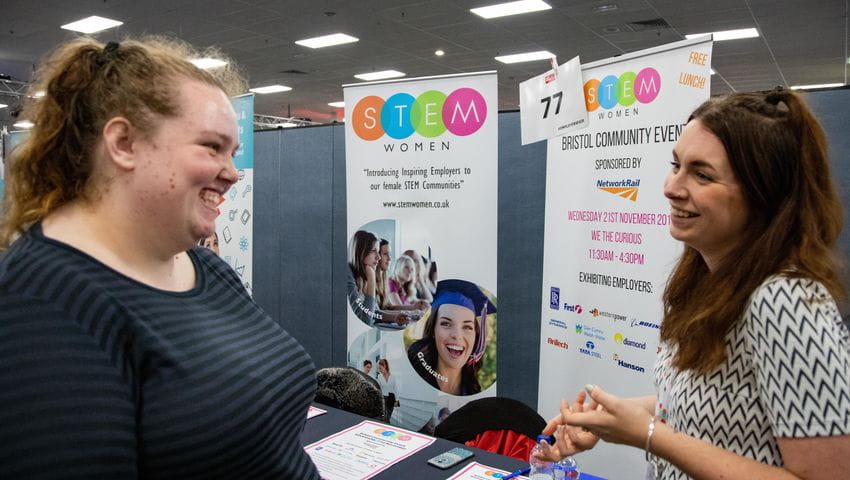 An employer talks to a student at the employers fair