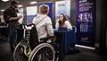 A student talks to an employer at the employers fair