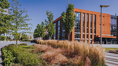 UWE Bristol's engineering building with a biodiverse planting bed in front.