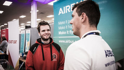 A student talks to an employer at the Employers Fair