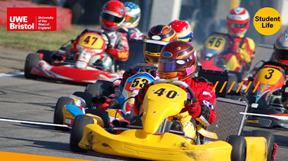 Go karts racing around a track.