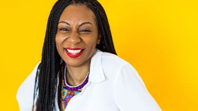 A picture of Aisha Thomas with yellow background