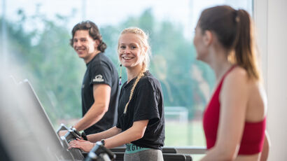 UWE Bristol students working out on treadmills in the gym.