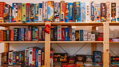 A shelf filled with hundreds of different board games. 