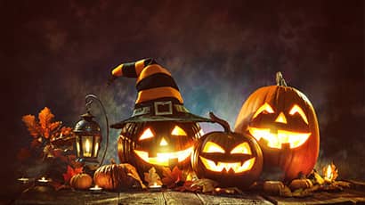 Smiling pumpkins with dark sky background