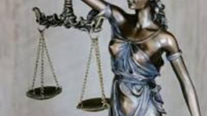 A statue holding a scale