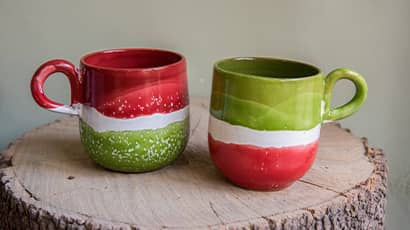 Two half red and half green mugs