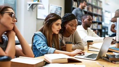 Students working together on laptop