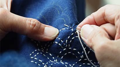 Sewing patterns on a blue fabric