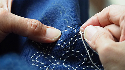 Sewing patterns on a blue fabric