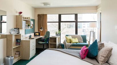 A well-lit student double bedroom.