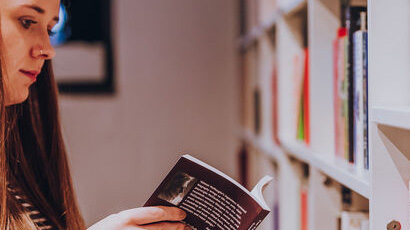 Students browsing the library and reading books