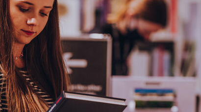 Student choosing library book