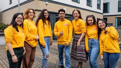 Student Life Team staff wearing Student Life uniform and taking a photo together.