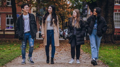 Students walking through a Bristol park.