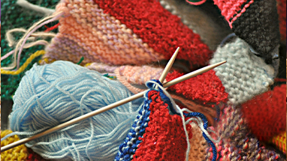 Colourful yarns and knitting needles