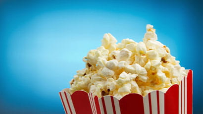 A box of popcorn with blue background 