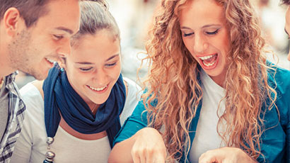 Three people discussing and laughing