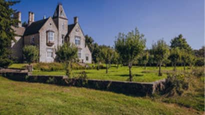 A view of the farmhouse and nature at Frenchay Campus 