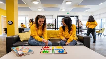 Students playing board games and having a good time 