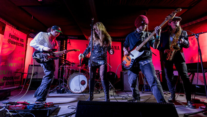 Band performing on stage at The Louisiana.