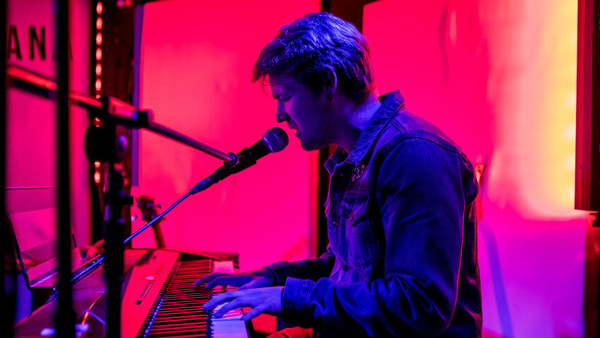 Keyboardist performing on stage at The Louisiana.