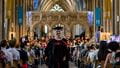 Graduate walking down the aisle in Bristol Cathedral after receiving their award