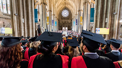 The crowd seated in Bristol Cathedral ready to watch a graduation ceremony