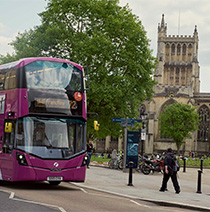 City bus driving past Bristol Cathedral