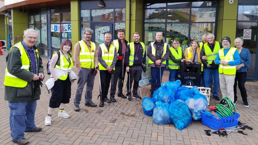 Students and volunteers taking part in a litter pick in the local community.