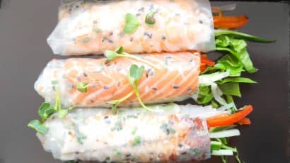 Three handmade Vietnamese summer rolls with vegetables.