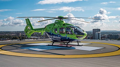 Great Western Air Ambulance helicopter on helipad.