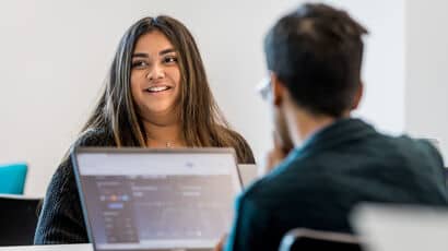 Students listening to a business lecture.