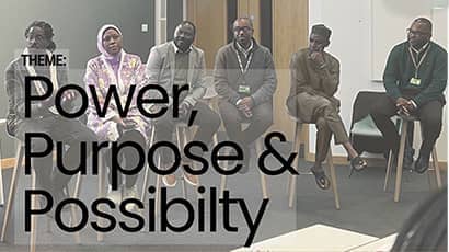 Group of six seated Black Professors (male and female).