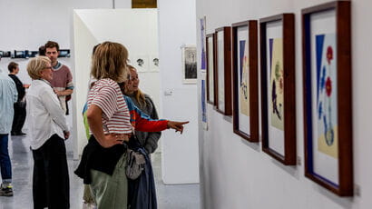 People looking at exhibits in an art gallery