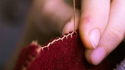 A close up of someone needle-felting.