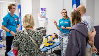 UWE Bristol Open Day tour guides talking to prospective students and parents in the Skills Simulation Centre.