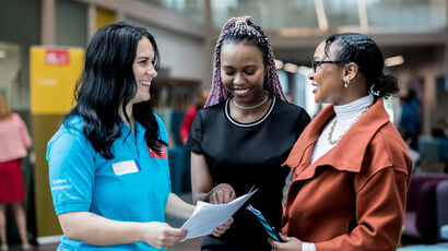 Parent and prospective student chatting with UWE Bristol Open Day tour guide.