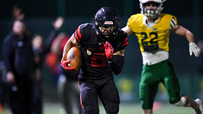 UWE Bullets American Football player running with the ball.