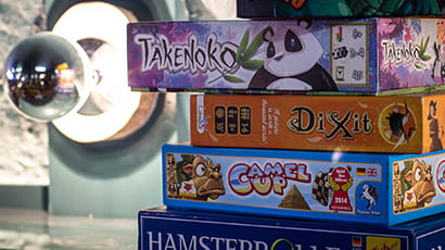 A stack of board game boxes