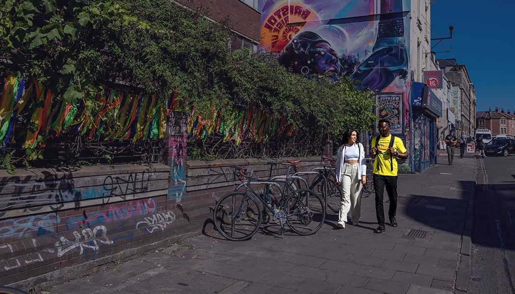 Students walking around Stokes Croft in Bristol City Centre.